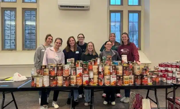 Halpern Law Firm staff packaging food at the Ardmore Food Pantry